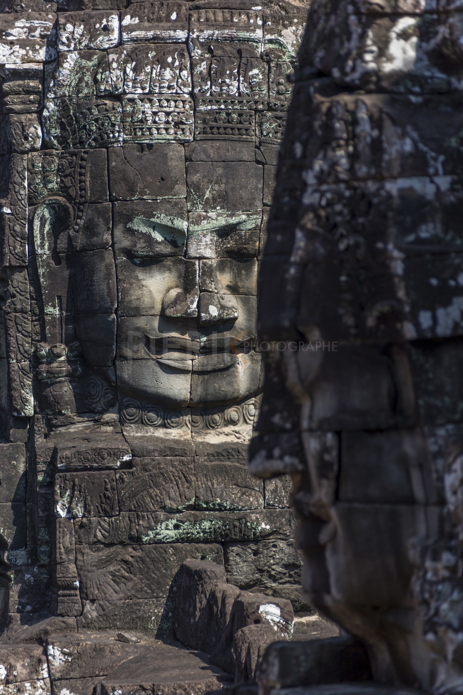 Têtes de bouddha au temple de Bayon - A buddha face in bayon temple